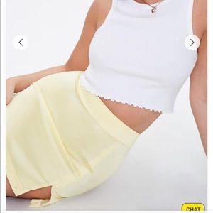 Yellow satin mini skirt